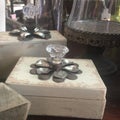 Rustic, wood and metal decorative boxes with antique cake stand.