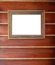 Rustic wood picture frame hanging on log wall. Royalty Free Stock Photo