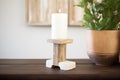 rustic wood pillar candle holder with a white candle