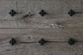 Rustic wood texture or background. Old wooden door with iron rivets Royalty Free Stock Photo