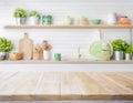 Rustic Wood Texture Table Against Blurry Kitchen Wall and Shelf Background Royalty Free Stock Photo