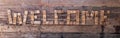 wood welcome sign hanging on old weathered fence