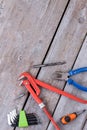 Rustic wooden background with different hardware tools.