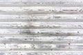 Rustic wooden background with faded white paint planks