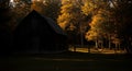 Rustic Wooden Barn in Autumn Woods at Sunset Royalty Free Stock Photo