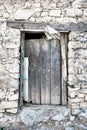 Rustic wooden barn door of an abandoned stone barn Royalty Free Stock Photo