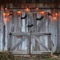 Rustic Wooden Barn Door with Spooky Halloween Decorations and Warm String Lights Royalty Free Stock Photo