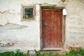 Rustic wooden barn door with white milk can