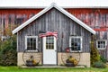 Rustic Wooden Barn with USA Flag Flying in Wind Royalty Free Stock Photo