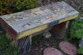 A Rustic Wooden Bench in a Garden Royalty Free Stock Photo