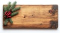Rustic Wooden Board with Festive Pine Branches, Berries, and Pinecones for Holiday Decor Royalty Free Stock Photo
