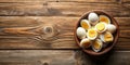 A rustic wooden bowl brimming with halved hard-boiled eggs rests on a weathered wooden surface, offering a simple yet appealing Royalty Free Stock Photo
