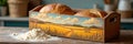 Rustic wooden bread box with painted landscape and fresh bread loaves in a kitchen setting Royalty Free Stock Photo
