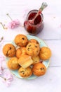 Rustic wooden breakfast background with fresh scones and raspberry jam Royalty Free Stock Photo