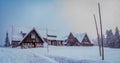 Rustic wooden cabin with snow-covered terrain in Crater Lake National Park. Oregon, USA Royalty Free Stock Photo