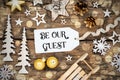Rustic Wooden Christmas Background, Bokeh, Label With Text Be Our Guest