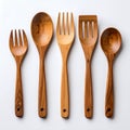 Rustic wooden cooking utensil arrangement showcasing texture and craftsmanship on white background Royalty Free Stock Photo