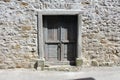 Rustic wooden doors on stone wall Royalty Free Stock Photo