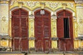 Rustic wooden doors of classic sino portuguese architecture in old town Phuket Thailand