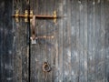 Rustic wooden gate with rusty padlock and lacth Royalty Free Stock Photo