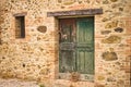 A rustic wooden green door in a stone cottage in the Italian countryside Umbria, Italy Royalty Free Stock Photo