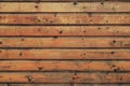 Bright brown rustic wooden timber cladding wood background. Brown wood texture background from natural tree. The wooden panel has Royalty Free Stock Photo