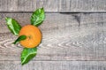 Rustic wooden plank table with trio of fresh picked ornages in t