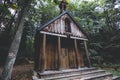 Rustic wooden roadside shrine in Holy Cross Mountains