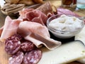 Rustic wooden serving tray with typical products of Italian Emilia-Romagna region