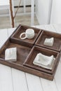 Rustic Wooden Serving Tray with White Ceramicware on a Bright Interior Setup Royalty Free Stock Photo