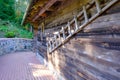 Rustic wooden stairs by the wall of the old wooden house. Latvian farm Royalty Free Stock Photo