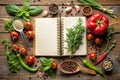 Culinary Ingredients and Open Recipe Book Arranged on a Wooden Surface open book cookbook Royalty Free Stock Photo