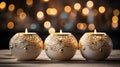 Three candles sit on a wooden table with lights in the background Royalty Free Stock Photo