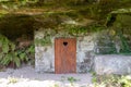 Rustic wooden toilet in the mountain with a heart-shaped hole in the door boards Royalty Free Stock Photo