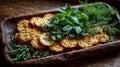 Rustic wooden tray with stack of crispy herb crackers, fresh green mint and dill, coarse salt crystals Royalty Free Stock Photo