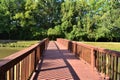 Rustic Wooden Walking Bridge Over Pond