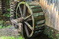Rustic wooden water wheel on farm Royalty Free Stock Photo
