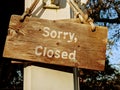 Rustic "Sorry, Closed" sign in front of an old country store Royalty Free Stock Photo