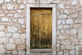 Rustic wooden door on old stone house Royalty Free Stock Photo