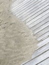 Rustic Yin Yang shape on sandy boardwalk