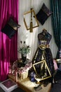 Rustical satin curtains, gold painted wooden frames and headless figurine in luxurious historical woman robe