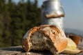 Rustically bread and milk churn on a wooden table Royalty Free Stock Photo