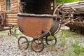 Rusting antique baby carriage