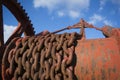 Rusting Chains on an Old Hoist Pointing into the Sky