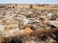 Rusting corrugated iron structures crammed into slum village in Soweto Royalty Free Stock Photo