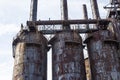 Rusting derelict steel mill blast furnaces with catwalks