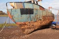 Rusting hulk of a fishing boat in Bagillt dock on the River Dee in Bagillt Flintshire North Wales