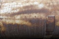 Rusting iron tank. Abstract industrial background