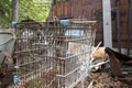 Rusting shopping cart in junkyard