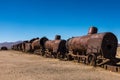 Rusting steam trains and carriages slowly rot away at the train graveyard just outside of Uyuni, Bolivia Royalty Free Stock Photo